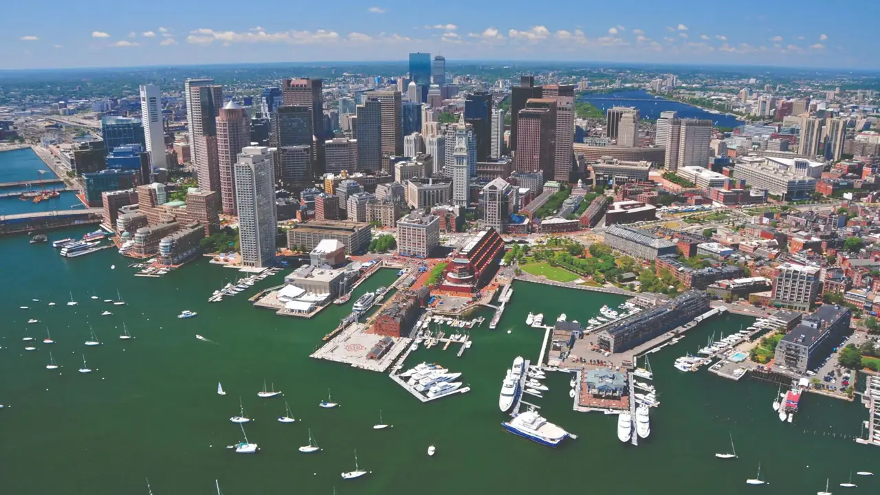 Aerial view of Boston's city skyline and harbour with moored boats