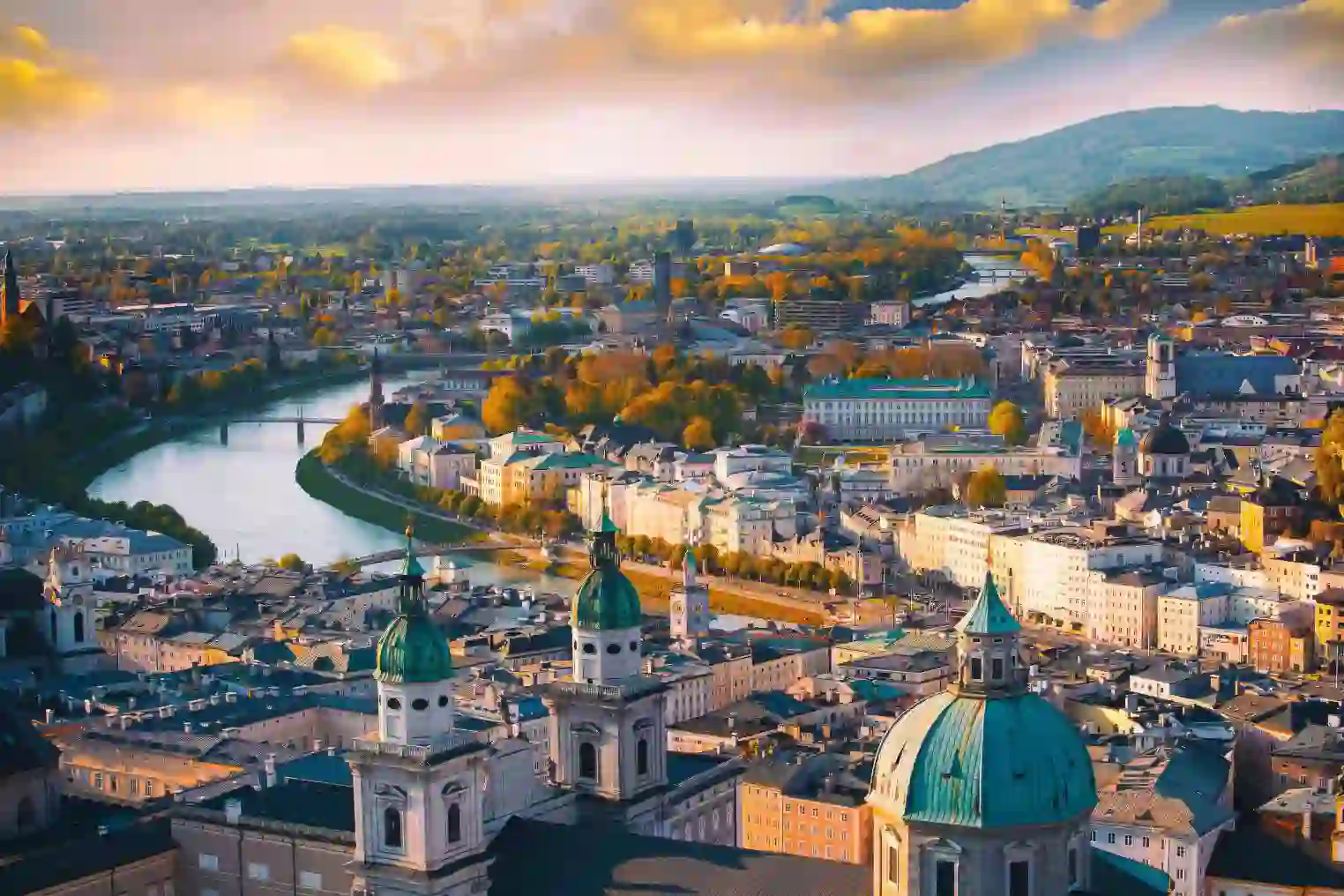 Panoramic view of the historic city of Salzburg and the Salzach river in the evening light