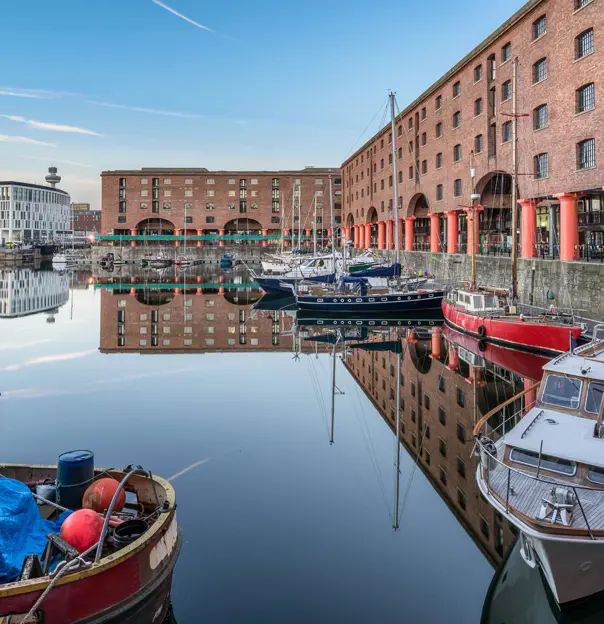 The Royal Albert Dock, Liverpool on a sunny day with boats in the harbour