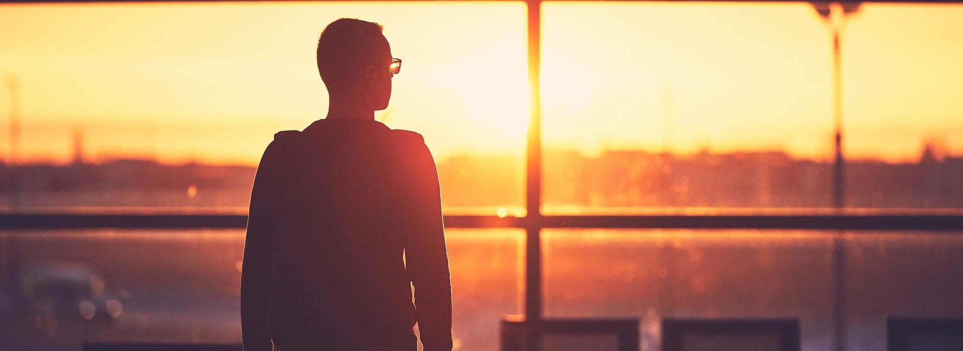 Person walking to departure gate in an airport