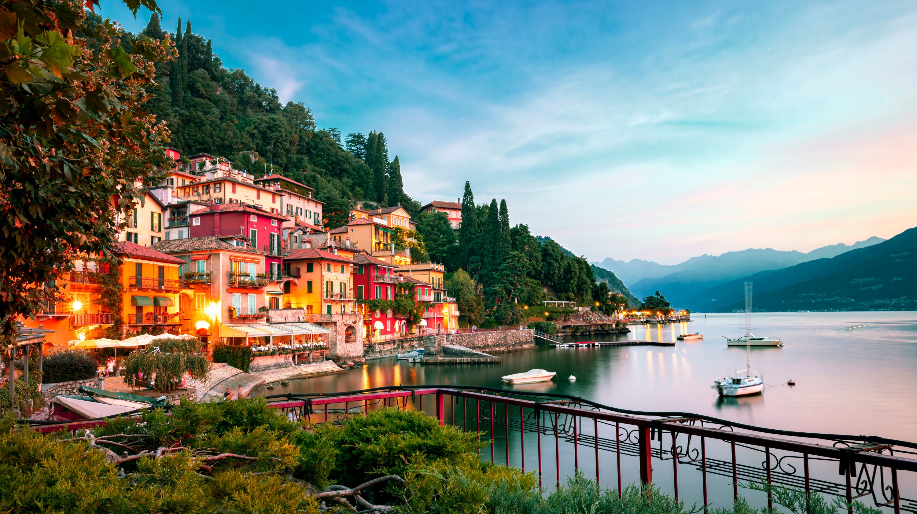 Buildings of Lake Como and the body of water at sunset