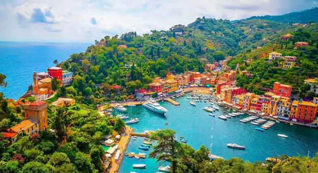 High-angle shot of colourful buildings alongside a marina in Portofino in Italy