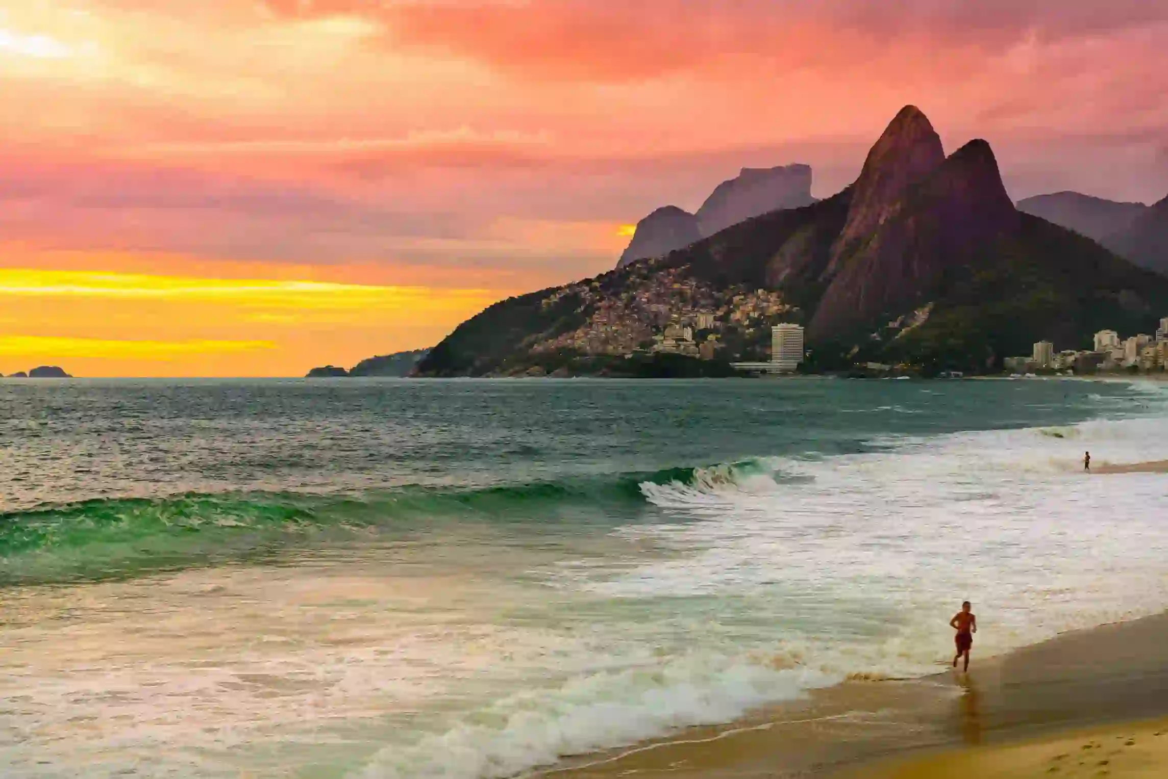 Vibrant view of a Rio de Janeiro beach with Sugarloaf Mountain rising in the background