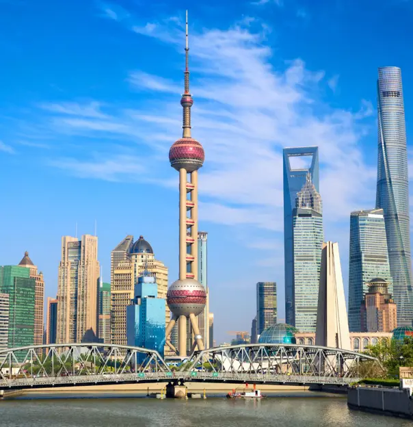 Modern skyscrapers and the Oriental Pearl Tower along the Huangpu River in Shanghai, China