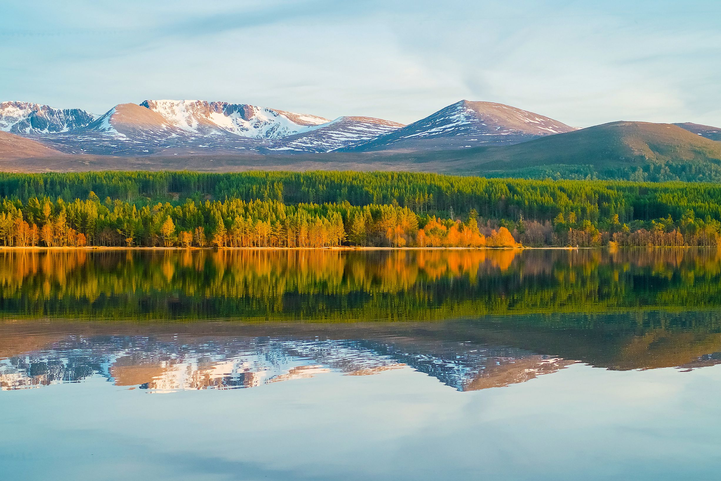 View of Cairngorm Mountains with a loch in the forefront 