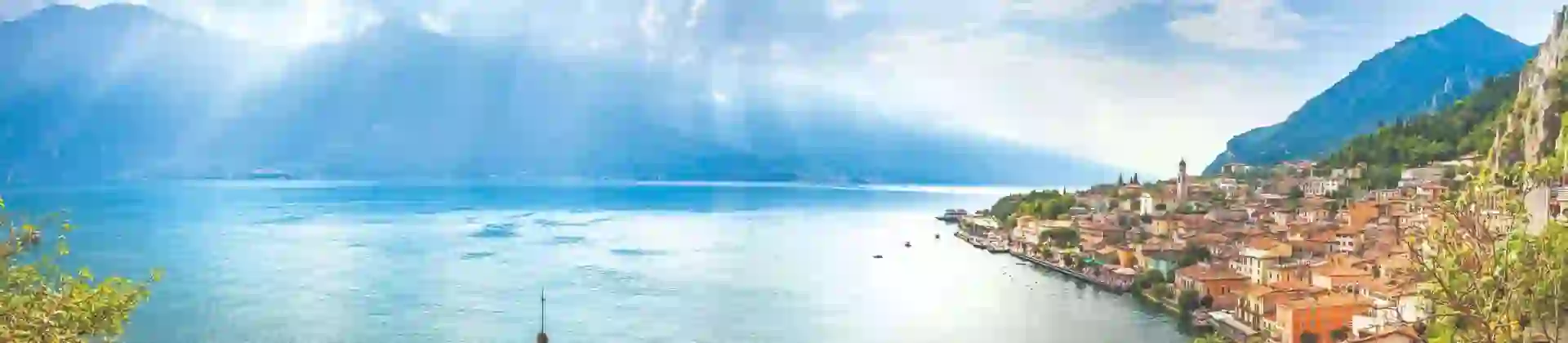 View of water from Limone, Lake Garda with buildings and boat in the forefront