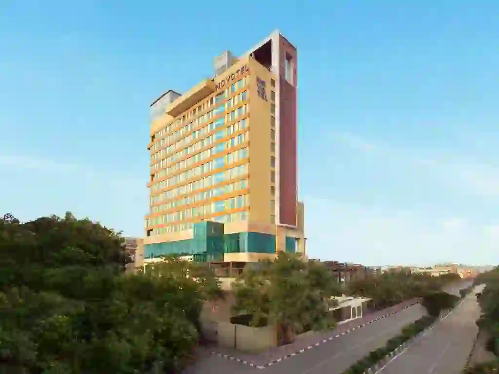 The exterior of Novotel New Delhi City Centre, a tall contemporary building with large windows