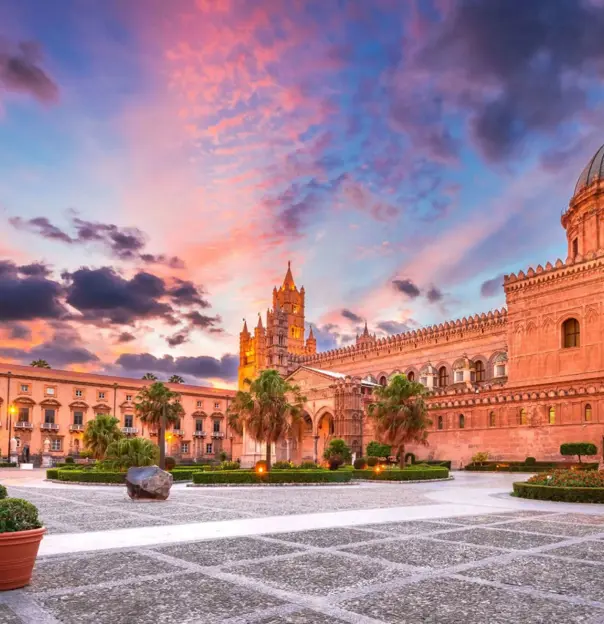 Palermo Cathedral at sunset, with warm light highlighting its historic architecture