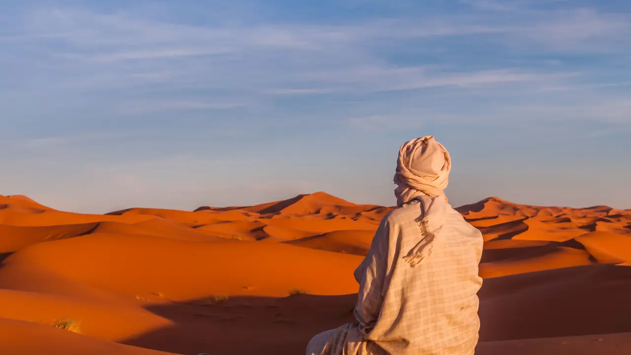 Berber stopping for prayer in the Sahara
