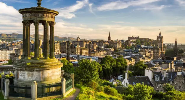 Edinburgh skyline at sunset from Calton Hill, with the Dugald Stewart Monument in the foreground