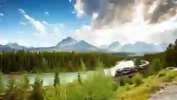 The Rocky Mountaineer train travelling through the Canadian Rockies, with rugged mountains in the background and dense evergreen forests lining the tracks