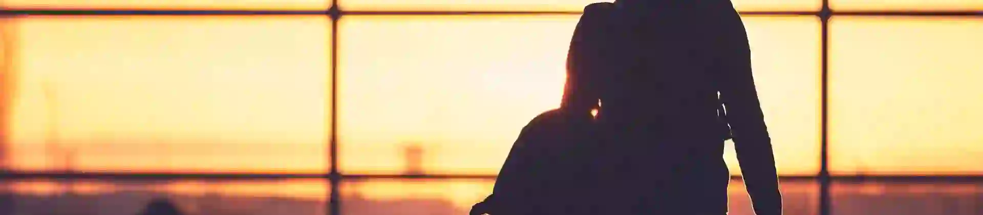 Person walking to departure gate in an airport